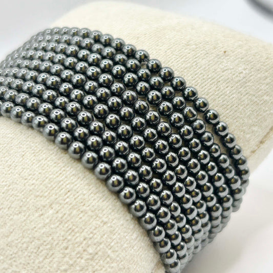 Close-up of Leopoldine Aurora bracelet with polished hematite gemstone beads – bold metallic shine and elegant stacked design, perfect for modern jewellery layering