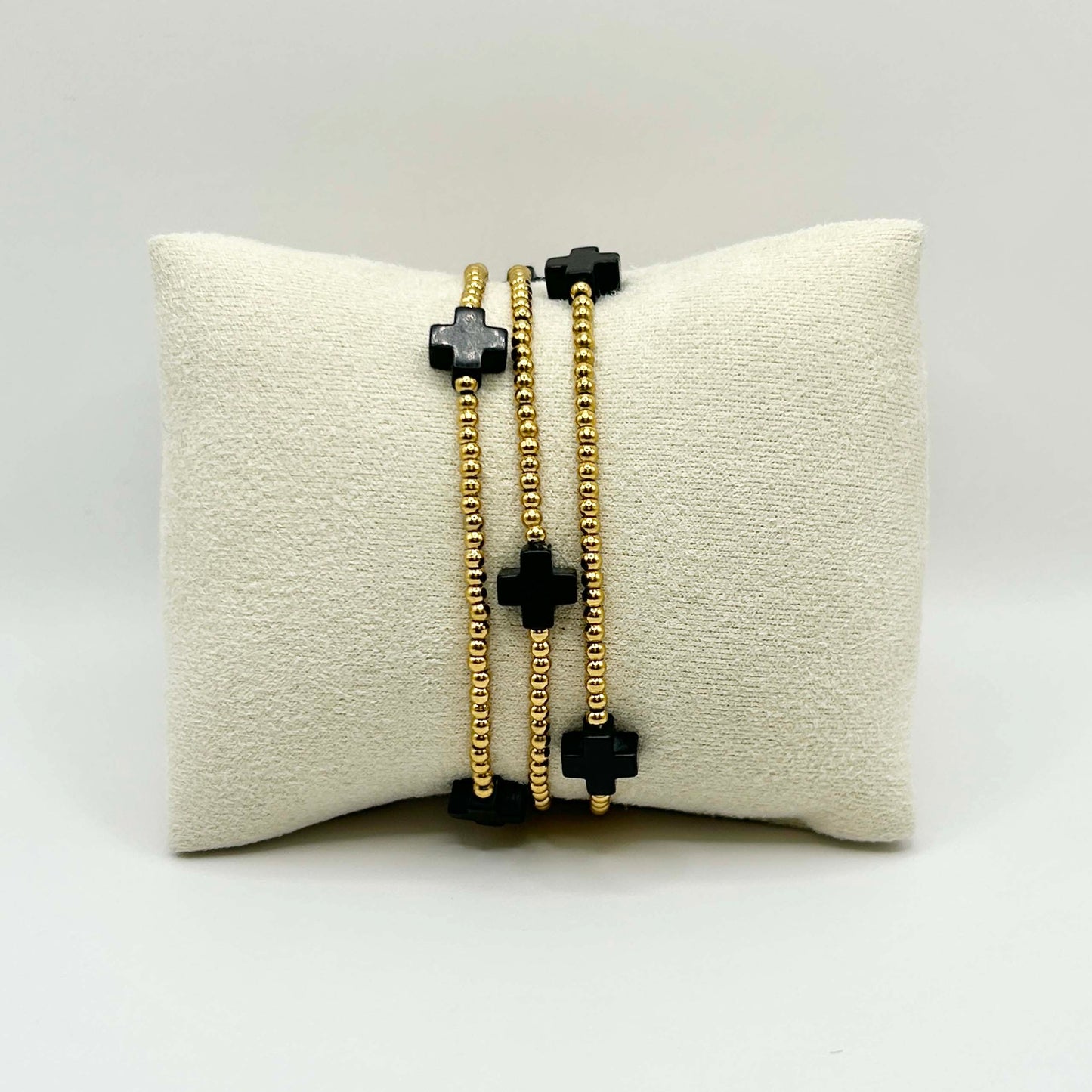 Leopoldine Divine bracelet with black cross beads and gold stainless steel detail – stylish and affordable stacking jewellery for everyday wear in the UK.