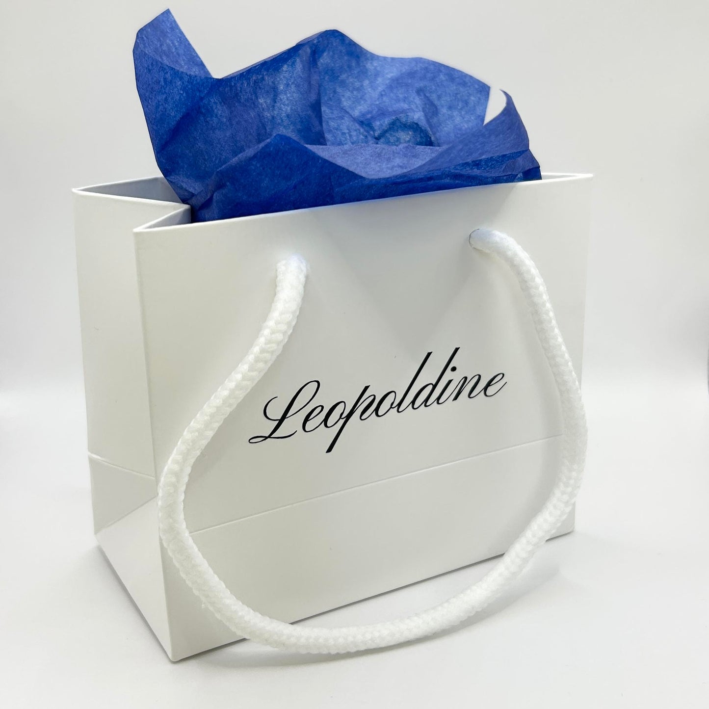 Optional Leopoldine branded gift bag with blue tissue paper – eco-friendly jewellery packaging for special occasions