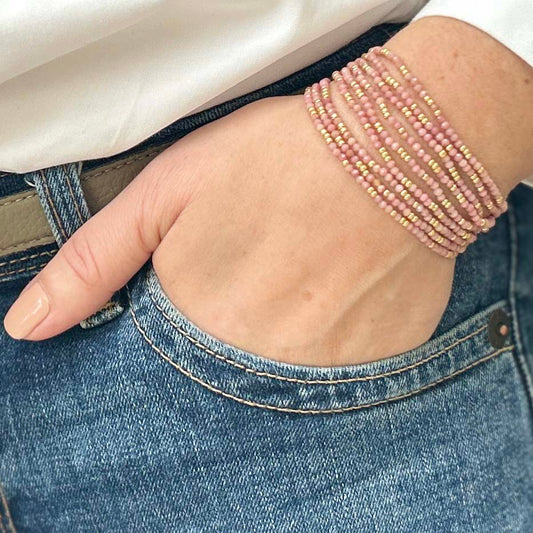 Affordable pink beaded bracelet from Leopoldine Selene – stylish stacking accessory worn casually with jeans, perfect budget-friendly gift for her