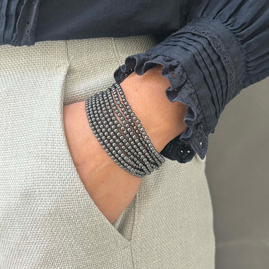 Sleek hematite bracelet stack – bold multi-strand metallic wristwear for modern UK styling.