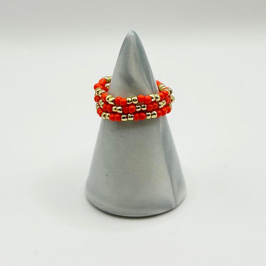 Leopoldine Confettis stackable rings in vibrant red and gold glass beads, affordable jewellery gift under £10 UK.