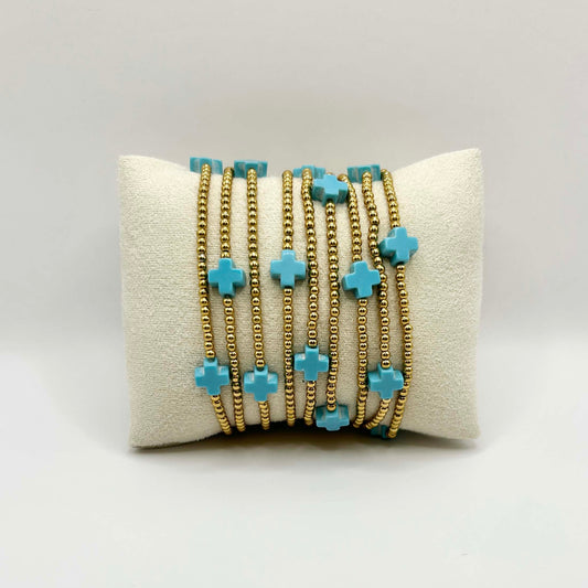 Leopoldine Divine bracelet with nine turquoise crosses – vibrant boho stacking bracelet with golden beads, cheerful and stylish accessory for women or teens.