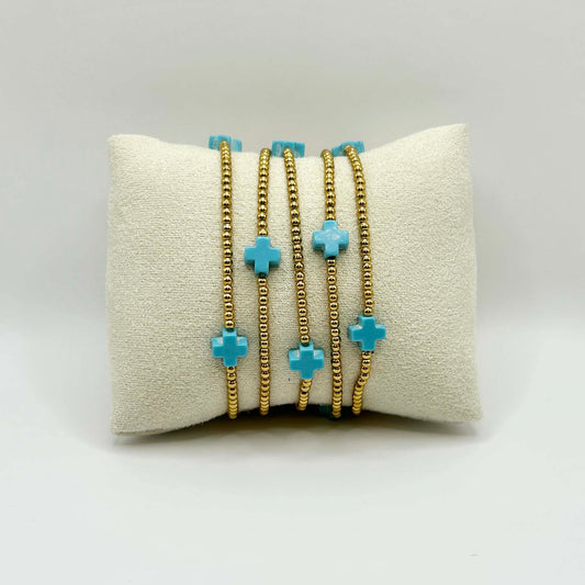 Five turquoise cross bracelet by Leopoldine Divine – bold, joyful stacking bracelet with golden beads, playful and symbolic, perfect gift under £50 for her or teens.
