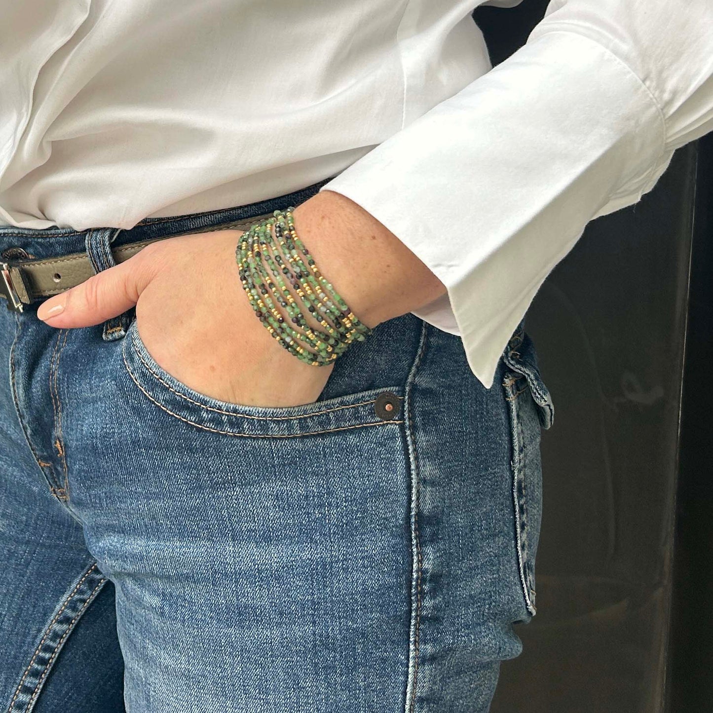 Leopoldine Selene bracelet – stack of green and gold glass bead strands, elegant and affordable jewellery with a boho chic twist.