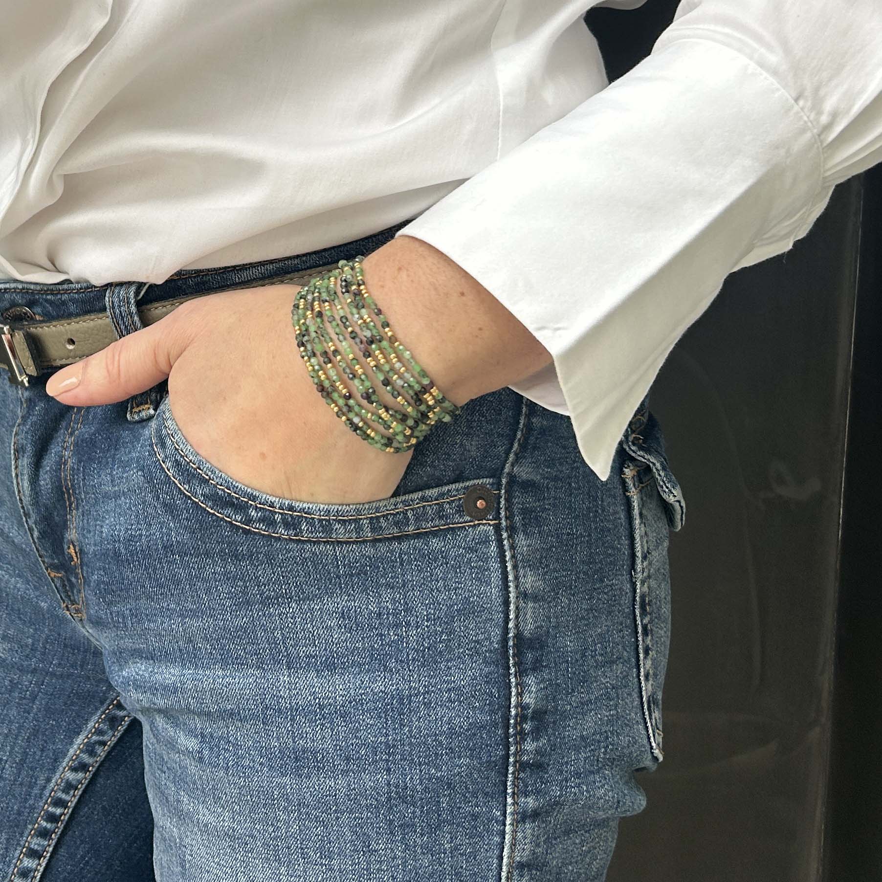Leopoldine Selene bracelet – stack of green and gold glass bead strands, elegant and affordable jewellery with a boho chic twist.