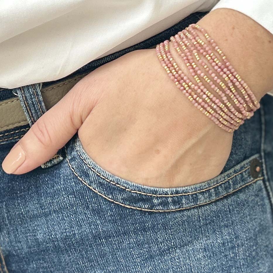 Affordable pink beaded bracelet from Leopoldine Selene – stylish stacking accessory worn casually with jeans, perfect budget-friendly gift for her